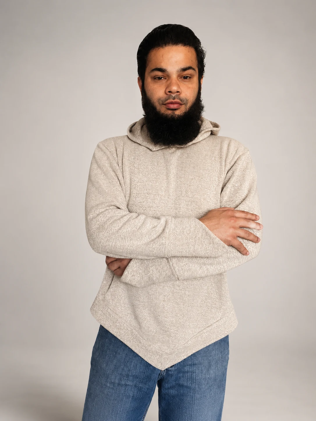 Male model wearing beige V-Silhouette Hoodie